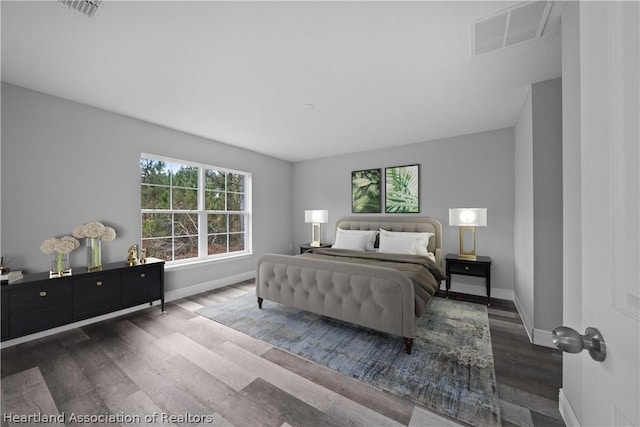 bedroom with dark wood-type flooring