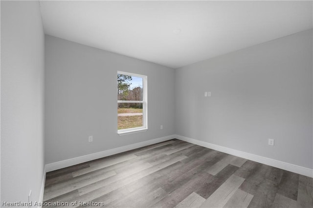 unfurnished room with light wood-type flooring