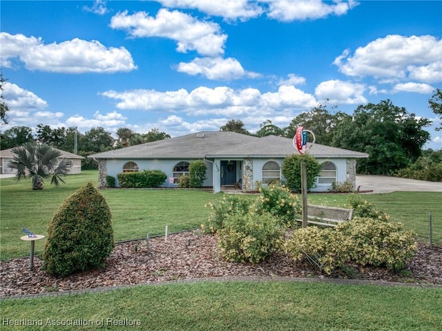 ranch-style house featuring a front yard