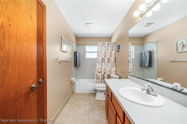 full bathroom with tile patterned floors, shower / tub combo with curtain, vanity, and toilet