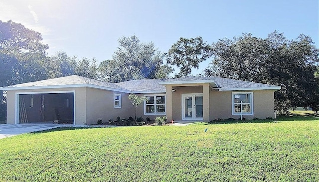 single story home with a front yard and a garage