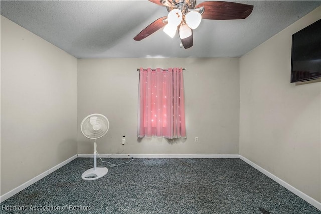 carpeted empty room featuring a textured ceiling and ceiling fan