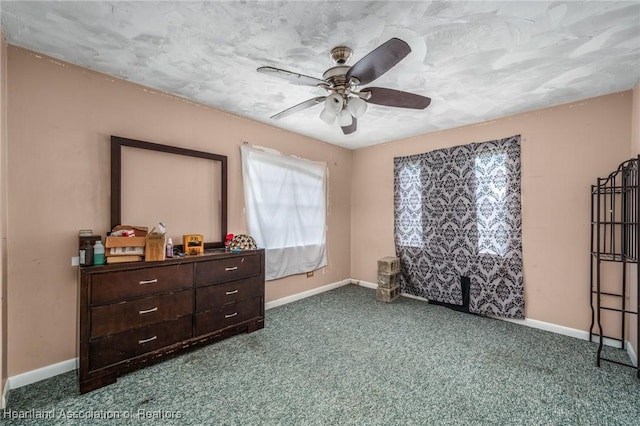 bedroom with carpet flooring, ceiling fan, and a textured ceiling