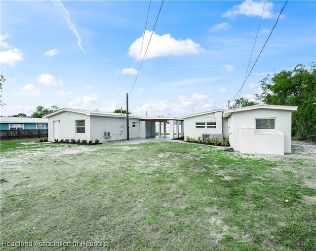 1802 E Claradge Ave, Avon Park, FL 33825 - back of house featuring stucco siding