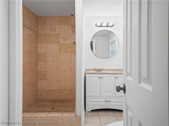 1802 E Claradge Ave, Avon Park, FL 33825 - bathroom with tiled shower, vanity, and tile patterned floors