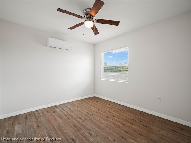 1802 E Claradge Ave, Avon Park, FL 33825 - empty room featuring a wall mounted AC, wood finished floors, baseboards, and a ceiling fan