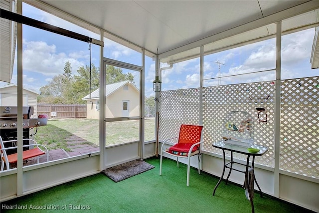 sunroom / solarium featuring plenty of natural light