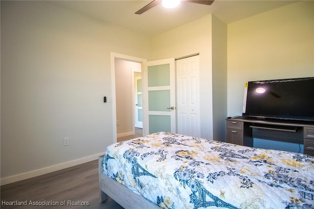 bedroom featuring a closet, ceiling fan, dark wood-type flooring, and baseboards