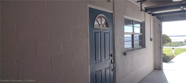 2131 Lakeview Dr Unit 106, Sebring, FL 33870 - property entrance with stucco siding