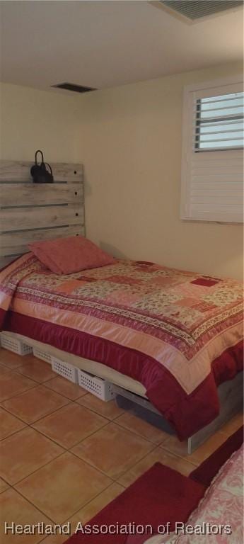 tiled bedroom with visible vents