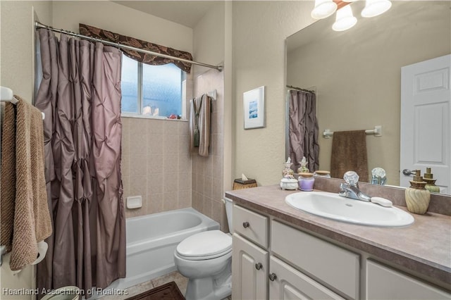 full bathroom featuring shower / bath combo with shower curtain, toilet, and vanity