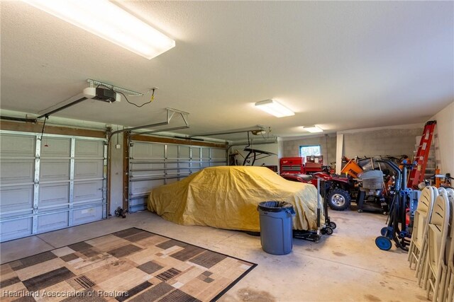 garage featuring a garage door opener