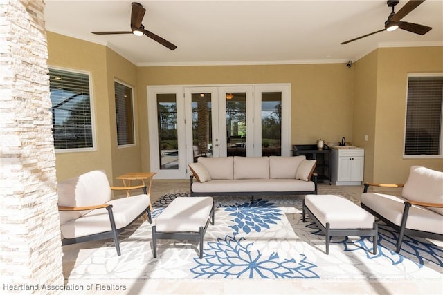 view of patio / terrace with french doors, an outdoor living space, and sink