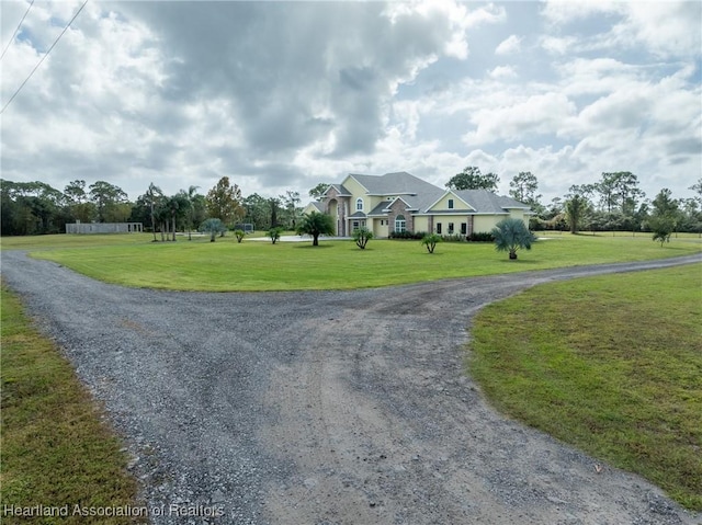 view of home's community with a lawn