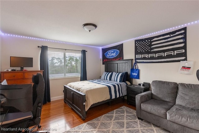 bedroom with wood-type flooring