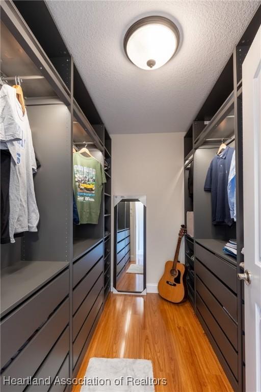 walk in closet featuring light wood-type flooring