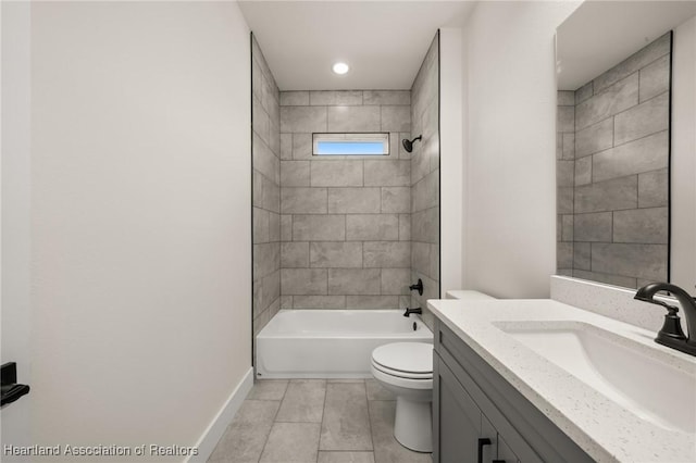 full bathroom with toilet, baseboards, tub / shower combination, vanity, and tile patterned flooring