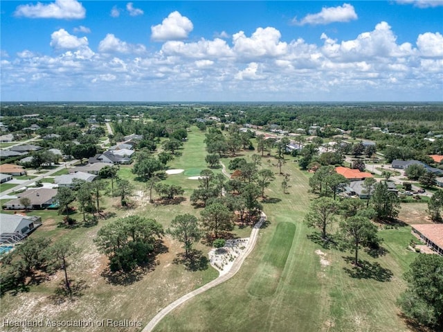 aerial view of residential area featuring a local golf course