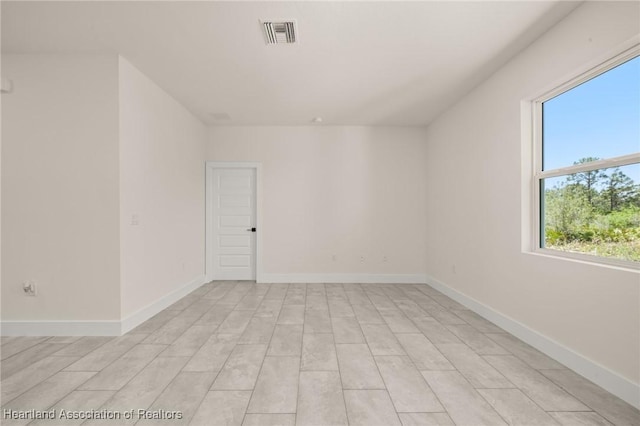 empty room with baseboards