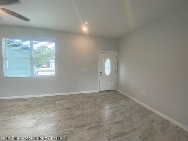 entrance foyer featuring ceiling fan and a healthy amount of sunlight