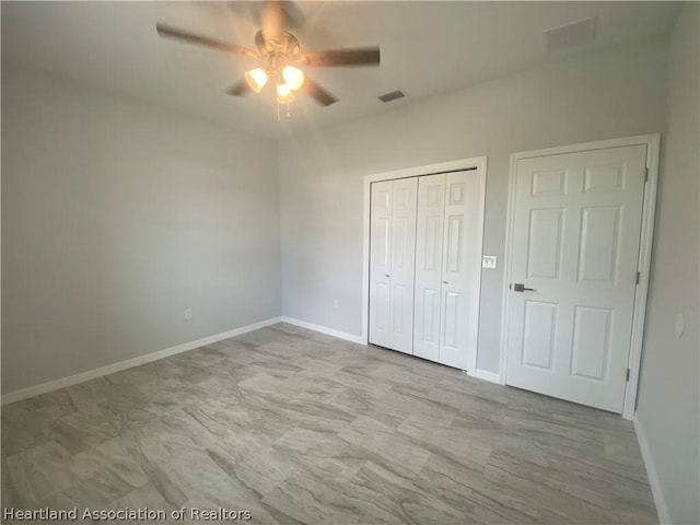 unfurnished bedroom featuring ceiling fan