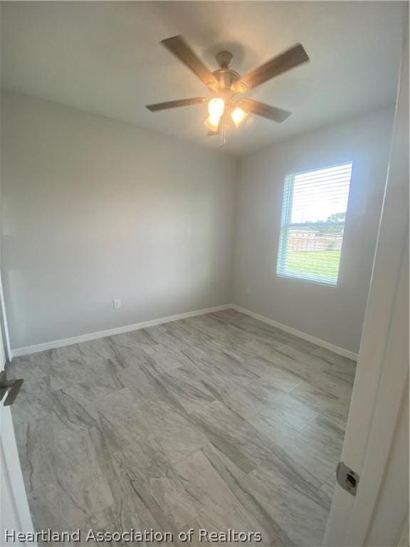 spare room featuring ceiling fan