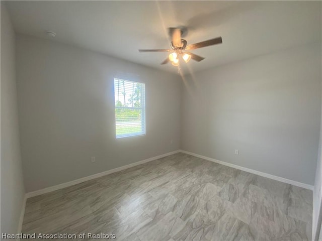 spare room featuring ceiling fan