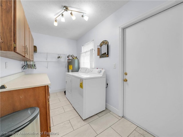 clothes washing area featuring light tile patterned flooring, cabinets, separate washer and dryer, a textured ceiling, and electric water heater