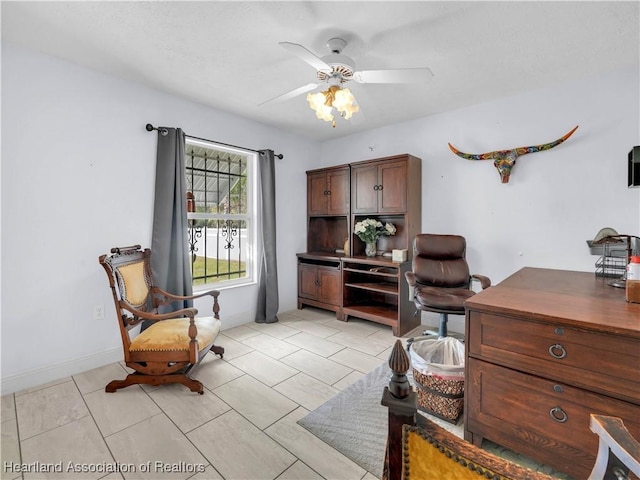 office with light tile patterned floors and ceiling fan