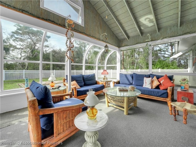 sunroom / solarium with wood ceiling and lofted ceiling with beams