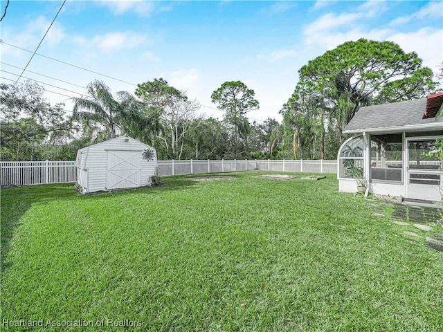 view of yard with a storage unit and a sunroom