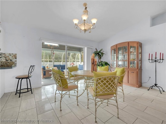 dining space featuring a chandelier