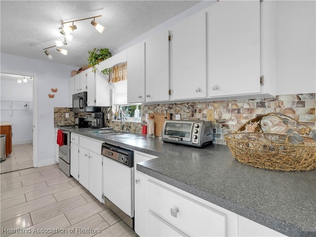 kitchen featuring sink, dishwasher, white cabinets, decorative backsplash, and stainless steel electric stove