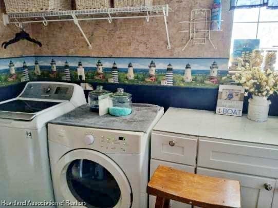 washroom with laundry area and washing machine and clothes dryer