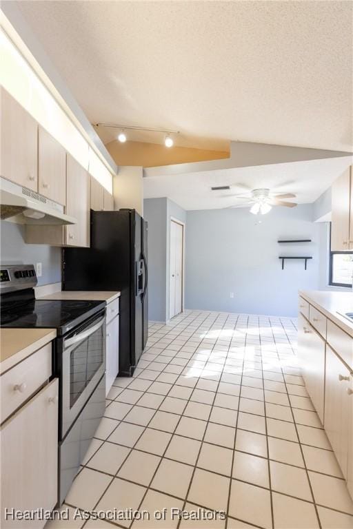 kitchen with lofted ceiling, a textured ceiling, light tile patterned floors, ceiling fan, and stainless steel electric stove