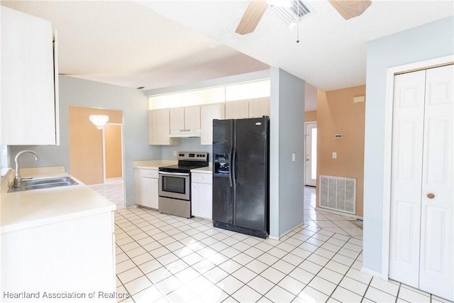 kitchen featuring sink, stainless steel electric range, light tile patterned floors, ceiling fan, and black fridge