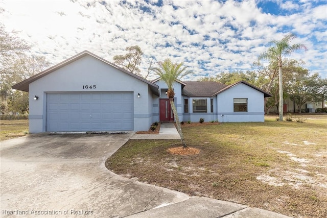 ranch-style home with a garage and a front yard