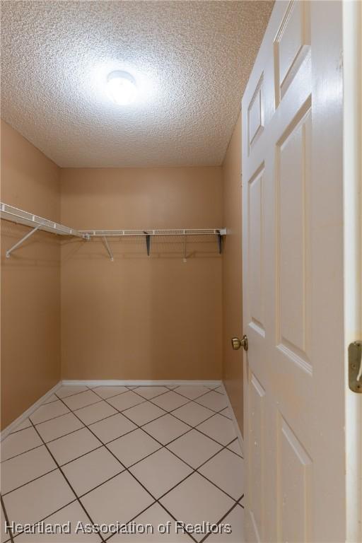 walk in closet featuring light tile patterned floors