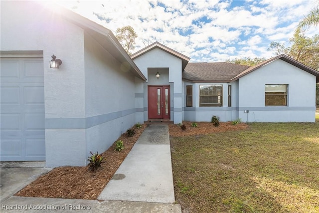 view of front facade featuring a garage and a front yard