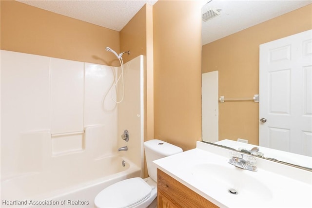 full bathroom featuring vanity, shower / bathtub combination, toilet, and a textured ceiling