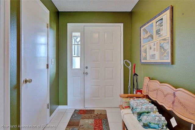 entrance foyer with light tile patterned floors