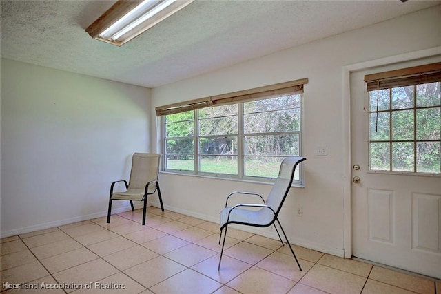 3800 Monza Dr, Sebring, FL 33872 - unfurnished room featuring plenty of natural light, a textured ceiling, and light tile patterned floors