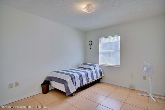 3800 Monza Dr, Sebring, FL 33872 - bedroom with a textured ceiling and light tile patterned floors