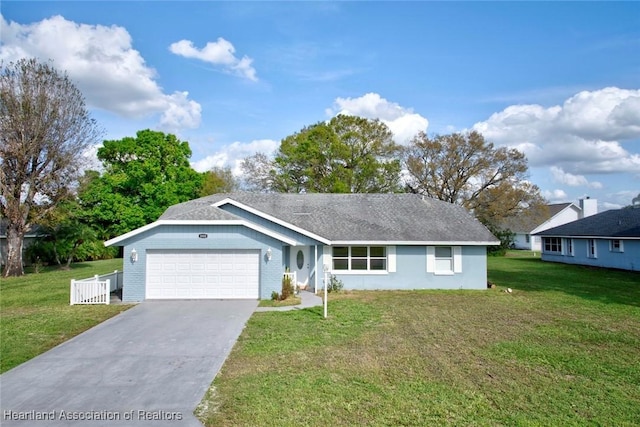 single story home featuring a garage and a front yard