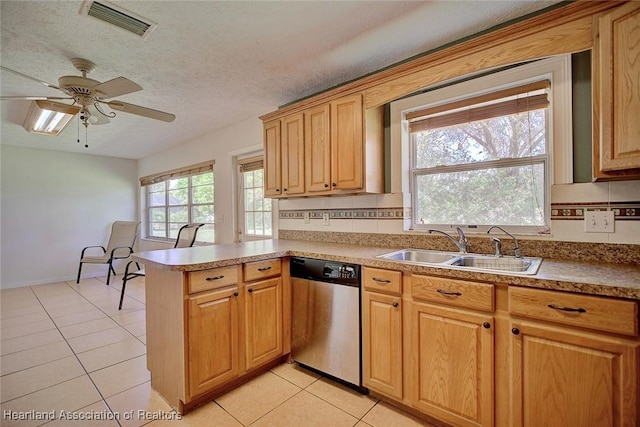 3800 Monza Dr, Sebring, FL 33872 - kitchen featuring light tile patterned floors, sink, stainless steel dishwasher, and kitchen peninsula