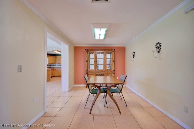 3800 Monza Dr, Sebring, FL 33872 - unfurnished dining area with light tile patterned floors and crown molding