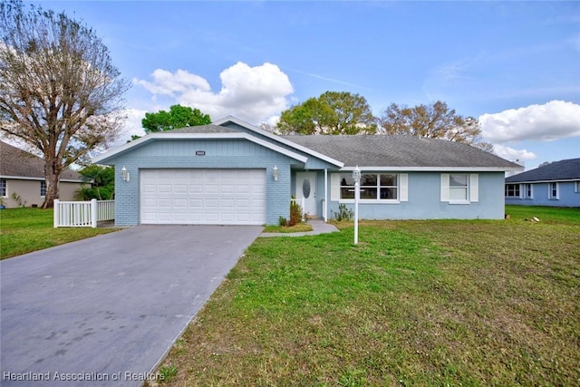 single story home featuring a front yard and a garage