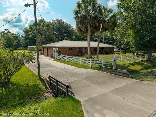 1900 N Riverdale Rd, Avon Park, FL 33825 - single story home featuring concrete driveway and an attached garage