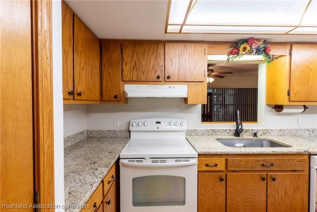 1900 N Riverdale Rd, Avon Park, FL 33825 - kitchen with white range with electric stovetop, under cabinet range hood, a sink, tasteful backsplash, and ceiling fan
