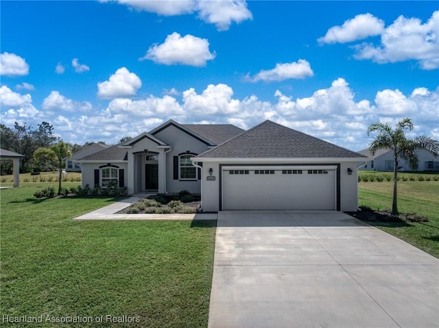 ranch-style home featuring a garage and a front lawn